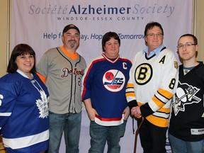 Danielle Laprade, left, Kieran McKenzie, Jim VanderVoort, Mark VanderVoort and Adam Moore attend the Alzheimer Society's Battle of the Brains fundraiser at the Ciociaro Club of Windsor on Jan. 13, 2017.