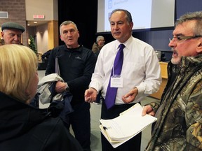 Dan Piescic, centre, Town of Tecumseh director of public works, had plenty of discussions during an open house on Jan. 26, 2017 for Tecumseh residents who were affected by widespread flooding last year. The informative event was held at École secondaire l'Essor.