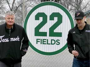 Dave Cooper (left) and Matt Stezycki stand by the player number 22 - retired for Don Fields at the Tecumseh Baseball Club at Lacasse Park. Photographed Jan. 3, 2017. Fields passed away Dec. 31 at the age of 70.
