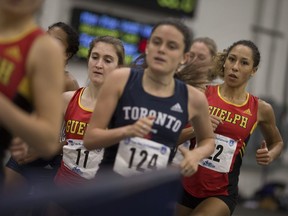 Runners compete in the women's 1000m at the University of Windsor's Can-Am Meet at Fairall Fieldhouse, Saturday, January 14, 2017.