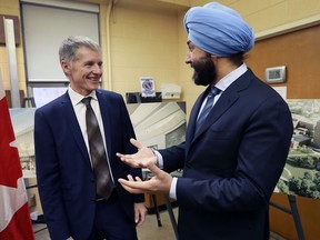 Navdeep Bains, right, Federal Minister of Innovation, Science, and Economic Development is shown with University of Windsor president Alan Wildeman at a funding announcement at the school on Jan. 12, 2017.