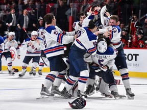Team U.S. players celebrate after winning the gold medal at the 2017 IIHF World Junior Championship in Montreal on Jan. 5, 2016. The U.S. defeated Canada in a shootout.