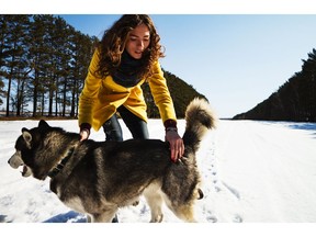 Walking the dog in the winter. Photo by Getty Images.