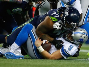 Matthew Stafford #9 of the Detroit Lions is sacked by Michael Bennett #72 of the Seattle Seahawks during the second half of the NFC Wild Card game at CenturyLink Field on Jan. 7, 2017 in Seattle, Washington.