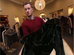 Warren Twigg holds a mink coat at Lazare's furs in Windsor on Jan. 12, 2017. The jacket is similar to a black sheared mink coat stolen in December.