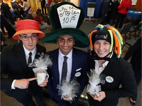 Best hat winners Marco Fagliarino, left, Jordan Kannampuzha and Brittany Hedderson pose for a picture during the kickoff for Hats On For Healthcare at the Odette School of Business in Windsor on Jan. 18, 2017.