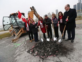 Dave Woodall, left, Ann Arquette, Mary Baruth Peter Hrastovec, Karen McDade Lisa Kolody and Mayor Drew Dilkens take part in the ground breaking for the Great Canadian Flag Project at the foot of Ouellette Avenue in Windsor on Jan. 25, 2017. Construction has started on the flag pole ground work. When finished, the flag pole will rise 150 feet into the air.