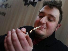 Joshua Jacquot smokes a joint at his home in Windsor on Jan. 25, 2017. Jacquot is upset because his company won't permit him to smoke medical marijuana at work even though he has a prescription.