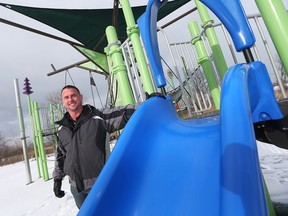 Playground designer Mark Jones is photographed on Jan. 6, 2017 next to the Lakeshore Woods Park playground which he designed.