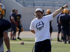 University of Windsor Lancers head coach Joe D'Amore offers instructions during drills at Alumni Field, as Lancers prepare for the 2015 OUA football season on Aug. 17, 2015.