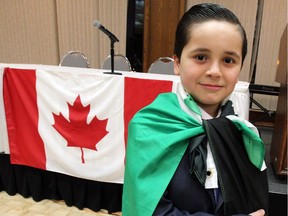 Yahia Jawish, 11, is shown with a Syrian flag around his shoulders at the Caboto Club of Windsor on Jan. 11, 2017. The youngster was among 75 people who attended a public meeting and documentary screening entitled We Are All Aleppo.