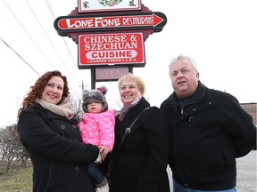 From left, Breanne Renaud,  her one year-old daughter Autumn, mother Gail Hayes, and father Dave Hayes are pictured outside the Lone Fone Restaurant on Walker Road on Jan. 13, 2017.  The owners of the restaurant are closing their doors and retiring after more than 40 years in business.