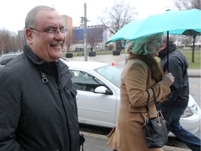 Rocco D'Angelo, left, leaves Superior Court of Justice with wife Doris, holding umbrella, on Jan. 17, 2017.