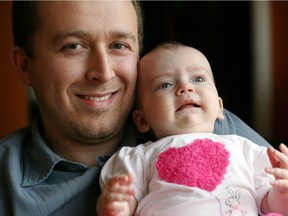 Windsor, Ontario. January 18, 2017 - Madalayna Ducharme, 5 months old, has recently been diagnosed with malignant infantile osteopetrosis January 18, 2017.  Madalayna is held by her father, Charles Ducharme at their family home in Riverside. (Nick Brancaccio/Windsor Star)  See story.