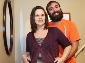 Parents-to-be Beth and John Trepanier are pictured at their home on Jan. 18, 2017. John will be running in a fundraising event called 40 miles for 40 weeks.