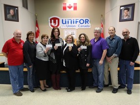 Charlie Yott and April McLellan, both from Unifor Local 200, left; Mary-Lynn Biggley, Jumpstart Student Nutrition Program; Julie Bondy, Windsor-Essex Autism Ontario; Mary Bondy, Sunshine Dreams for Kids; Luciana Rosu-Sieza, executive director of the Bulimia Anorexia Nervosa Association;  Mark Renaud, vice-president Unifor Local 200; Dan Cassady, financial secretary for Unifor Local 200; and Darby McCloskey, Unifor Local 200, attend a presentation of $20,000 by Unifor Local 200 to various programs in Windsor-Essex.