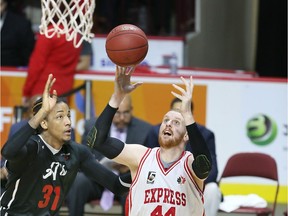Windsor Express centre Nick Evans fights for rebound against Orangeville A's Slim McGee in NBL Canada action at the WFCU Centre on Jan. 25, 2017. Evans scored on the play.
