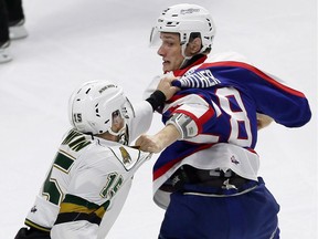 Windsor Spitfires Tyler Nother, right, fights Cole Tymkin of the London Knights during OHL action at the WFCU Centre on Jan. 3, 2017.