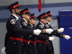 Five new recruits who have successfully completed Police College/Training are sworn in during the Windsor Police Service Badge Presentation Ceremony in Windsor on Jan. 5, 2017. Shown are Const. Jesse Soufane, left, Const. Jordan Caron, Const. Emily Ferris, Const. Adam Repsys, and Const. Marc Tremblay.