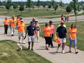 LaSalle Mayor Ken Antaya, second from right, joins a walking group  during the County Wide Active Transportation System event near the Vollmer Complex in LaSalle on May 31, 2016. Essex County council voted Wednesday to spend an extra $2.8 million in 2017 on paved shoulders for cyclists and pedestrians.