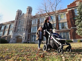 Rachel Elekes  and her children walk past Giles Campus French Immersion Public School on  Giles Avenue on Nov. 9, 2015.