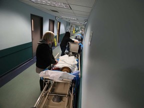 Patients line the hallways at Windsor Regional Hospital's Met Campus on Jan. 18, 2017.