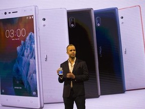 Juho Sarvikas, Chief Product Officer of HMD Global, shows the new Nokia 3 smartphone, ahead of Monday&#039;s opening of the Mobile World Congress wireless show in Barcelona, Spain, Sunday, Feb. 26, 2017. Finland-based HMD Global is re-launching the simple Nokia 3310 model along with unveiling three new devices at Mobile World Congress in Barcelona. (AP Photo/Emilio Morenatti)