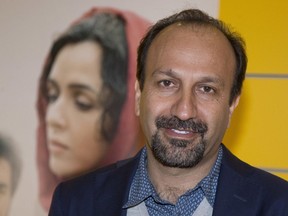 In this Oct. 10, 2016 photo, Iranian director Asghar Farhadi poses for a photo during the premiere of his film, The Salesman, in Paris. Iran's top diplomat has congratulated director Asghar Farhadi for winning the Oscar in the best foreign language category with his film The Salesman. Mohammad Javad Zarif saw the prize as a move against President Donald Trump's effort to bar U.S. entry to citizens from seven majority Muslim countries, including Iran. Zarif tweeted: "Proud of Cast and Crew of "The Salesman" for Oscar and stance against #MuslimBan. Iranians have represented culture and civilization for millennia."