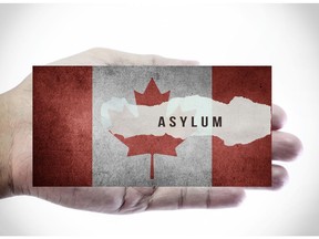 Asylum on Canadian flag. Image by Getty Images.