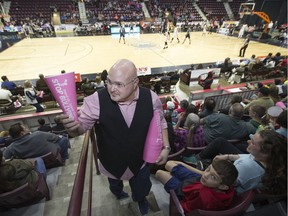 Patrick Kelly, co-chair of SAFE Windsor-Essex, hands out pink blow horns for SAFE's kickoff for an anti-bullying campaign during the Windsor Express game at the WFCU Centre, Sunday, Feb. 19, 2017.