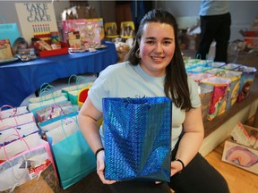 Jessica Flammia, pictured, a University of Windsor student, came up with an idea to collect cake mixes and frosting to give to needy families so kids can have a cake on their birthdays. Seven local Anglican churches got behind the drive and 300 full kits were collected. They were packaged at St. James Roseland Anglican Church on Saturday, February 25, 2017.