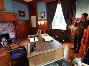 Daniel Todhunter snaps a photo of Hiram Walker's office during a tour of the Canadian Club Brand Centre in Windsor on Feb. 10, 2017.