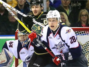 London captain J.J. Piccinich, left, is tied up in the crease by Tyler Nother of the Spitfires in front of Windsor goalie Michael DiPietro Friday Feb. 24, 2017 game at Budweiser Gardens.