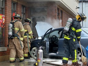 Smoke rises from a stolen vehicle that slammed into the side of Tim Hortons at the corner of Goyeau and Park streets in Windsor on Feb. 7, 2017. Windsor police arrested the driver who was wanted in connection with the motor vehicle theft that happened earlier Tuesday morning in the 1200 block of Askin Avenue.