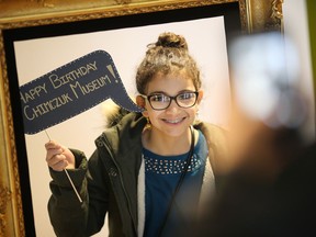 Yara Abouzeeni, 11, poses for a photo for her mother at the Chimczuk Museum's birthday celebration, Saturday, Feb. 18, 2017. The museum is celebrating their first birthday with free admission and new exhibits.