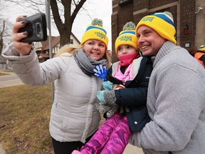 Alana Beemer and her husband Gary Beemer take a selfie with their daughter Alyvvea, 5, at the Coldest Night of the Year walk event on Saturday, February 25, 2017. It was a fundraiser for the Downtown Mission.