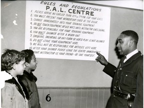 Const. Howard Watkins goes over the Police Athletic League's rules and regulations in this Feb. 2, 1957 file photo. He later became a detective.