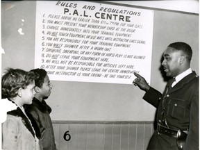 Const. Howard Watkins goes over the Police Athletic League's rules and regulations in this Feb. 2, 1957 file photo