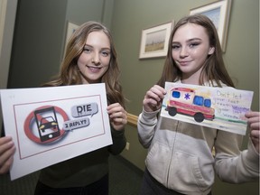 Grace Bower, 16, left, a Grade 11 student at Tecumseh Vista, and Irelynn Chartier, 14, a Grade 9 student at Belle River high school, won the top prize in their schools for their distracted driving campaigns. The girls are pictured on Feb. 7, 2017 at Tecumseh Town Hall.