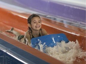 Dallas Payne, 5, takes a ride down the Whizzard at Adventure Bay Family Water Park as families filled the park celebrating Family Day  on Feb. 20, 2017.