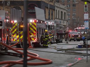 WINDSOR, ON.: FEBRUARY 12, 2017 -- Windsor fire crews battle fire at 52 Chatham St. W., formerly the Pour House pub, Sunday, February 12, 2017.   (DAX MELMER/The Windsor Star)