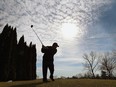 Chris Lucas tees off at the Orchard View Golf Club in Ruthven on Friday, Feb. 17, 2017. Unseasonably warm weather brought out several diehard golfers.