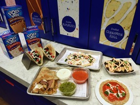 Menu items at Pop-Tarts Café are displayed on Feb. 21, 2017, in New York's Times Square.  The menu features indulgent, toaster pastry twists on classic New York favourites — including pizza with a Pop-Tarts crust, nachos with Pop-Tarts "chips" and tacos with Pop-Tarts filling and sweet toppings.