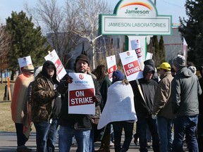 Striking Jamieson employees represented by Unifor Local 195 picket at the company's 4025 Rhodes Dr. location on Feb. 26, 2017.