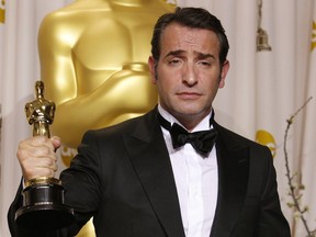 This Feb. 26, 2012 photo shows Jean Dujardin with his award for best actor for The Artist during the 84th Academy Awards in the Hollywood section of Los Angeles. Dujardin portrayed silent movie actor George Valentin at the arrival of talking pictures.