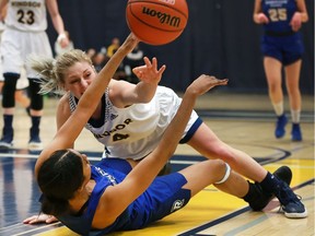 Ryerson's C'airah Gabriel-Robinson, left, battles Caitlyn Longmuir of the Windsor Lancers during OUA action on Feb. 25, 2017 at the St. Denis Centre.