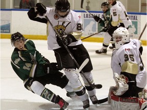 LaSalle Vipers Kyler Carter and goaltender Eli Billing (35) defend against St. Thomas Stars Dane Johnstone in Junior B hockey action from the Vollmer Centre on Oct. 15, 2014.