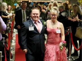 Shawn Rivait and Kelsea Noel, right, arrive for the Special Needs Prom at Western Secondary School on Feb. 10, 2017. The event was organized by The Gathering Church, part of the Tim Tebow Foundation's Night to Shine initiative.