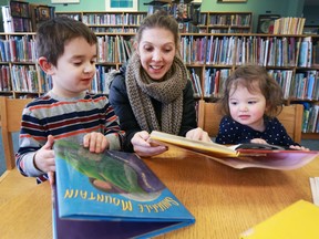 Crystal Vaillancourt reads books with her children Nolan, 4, and Norah, 2, at the Tecumseh branch of the Essex County Library System on Friday, Feb. 17, 2017. The county branches are back in business after a lengthy strike.