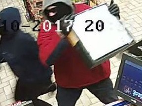 Suspects wanted in connection with a theft from a convenience store in the 3800 block of Walker Road on Feb. 10, 2017 is pictured in this police handout photo.